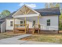 A charming single-story home features a welcoming front porch and a well-maintained yard at 522 Waco Rd, Kings Mountain, NC 28086