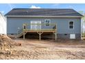 Rear exterior of the house with deck, and access to the backyard at 524 Waco Rd, Kings Mountain, NC 28086