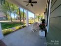 Covered front porch showcasing a rocking chair, ideal for enjoying outdoor relaxation and neighborhood views at 788 N Main St, Mount Pleasant, NC 28124