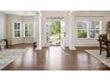 Bright foyer with beautiful wood floors, natural light, and an open doorway to the outside at 79411 Ridgehaven Rd, Indian Land, SC 29720