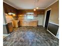A kitchen featuring wooden cabinetry, neutral walls, and mixed flooring at 1217 Stony Point Rd, Kings Mountain, NC 28086