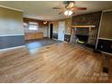 Open living room with hardwood floors, a fireplace, and entry to the kitchen at 1217 Stony Point Rd, Kings Mountain, NC 28086