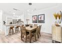 Open concept dining area adjacent to kitchen with modern lighting and decor at 12357 Copper Mountain Blvd, Charlotte, NC 28277