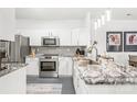 Bright kitchen with stainless appliances, granite counters and a breakfast bar at 12357 Copper Mountain Blvd, Charlotte, NC 28277