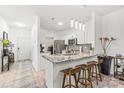 Modern kitchen featuring granite countertops, stainless appliances and breakfast bar seating at 12357 Copper Mountain Blvd, Charlotte, NC 28277