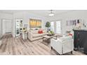 Open living area with neutral tones, hardwood floors, and ample seating at 12357 Copper Mountain Blvd, Charlotte, NC 28277
