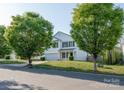 Two-story home with an attached garage and lovely trees in a well-kept community at 1430 Eastway Dr, Dallas, NC 28034
