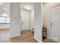 Bright foyer with neutral walls, wood floors, and convenient access to the kitchen at 1588 Trentwood Dr, Fort Mill, SC 29715