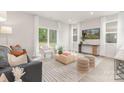 Bright living room featuring neutral tones, modern furnishings, and natural light streaming through large windows at 1706 30Th Avenue Ne Ct, Hickory, NC 28601