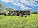 Spacious backyard featuring a deck with outdoor seating, perfect for entertaining and relaxation at 171 Westmoreland Rd, Mooresville, NC 28115