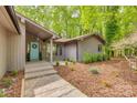 Attractive home featuring manicured landscaping leading up to the entrance, complemented by a welcoming, light-blue door at 2058 Manila Bay Ln, Fort Mill, SC 29708