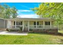 Charming home with inviting porch and flower beds at 2315 Collins Dr, Albemarle, NC 28001