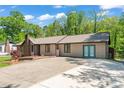 Charming one-story home featuring a brick chimney, well-manicured lawn, and inviting curb appeal at 2615 Toddville Rd, Charlotte, NC 28214