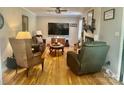 Cozy living room with hardwood floors, a fireplace, and comfortable seating at 3063 Wimbledon Ln, Rock Hill, SC 29732