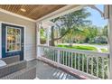 Relaxing front porch with seating, offering a pleasant outdoor living space at 3709 Commonwealth Ave, Charlotte, NC 28205
