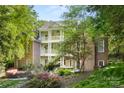 Multi-level deck overlooking a lush, private backyard with mature landscaping and ample space to relax at 3819 Gleneagles Rd, Charlotte, NC 28210