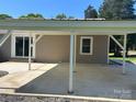 Spacious covered parking area with a concrete floor, providing ample space for vehicles at 427 W Whitley St, Norwood, NC 28128