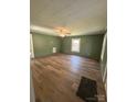 Bright living room with wood floors, neutral paint, and ample natural light at 427 W Whitley St, Norwood, NC 28128
