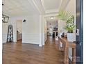 Inviting entryway featuring hardwood floors, wainscoting, and an open view into the living space at 4606 Gatesmills Ave, Charlotte, NC 28213