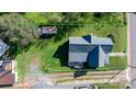 Aerial view of a landscaped property showcasing a charming home, storage building, and expansive yard at 71 14Th Se St, Hickory, NC 28602