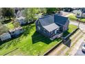 Aerial view of a charming gray home with a well-maintained lawn and mature trees at 71 14Th Se St, Hickory, NC 28602