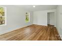 Bright, airy bedroom featuring new hardwood floors, fresh paint, large windows and lots of natural light at 76 Snyder Ne Ct, Concord, NC 28025