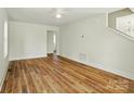 Spacious living room with new hardwood floors, fresh paint, lots of natural light and inviting atmosphere at 76 Snyder Ne Ct, Concord, NC 28025