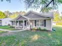 Charming single-story home with inviting front porch, beautiful landscaping, and a welcoming entrance at 833 Generation Ln, Clover, SC 29710