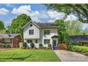 Charming two-story home featuring a landscaped front yard and a covered front porch at 908 Academy St, Charlotte, NC 28205