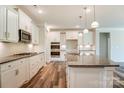 Modern kitchen with granite countertops, stainless steel appliances, and a center island at Tbd Boomer Ct # 4, Statesville, NC 28677