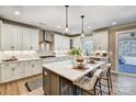 Spacious kitchen with white cabinets, stainless steel appliances, and a large center island at Tbd Boomer Ct # 5, Statesville, NC 28677