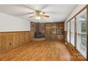 Inviting living room with wood-burning fireplace, built-in shelves, and natural light at 119 Legacy Ln, Harmony, NC 28634