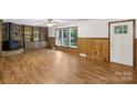 Inviting living room with wood-burning fireplace, built-in shelves, and natural light at 119 Legacy Ln, Harmony, NC 28634