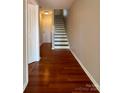 Bright entryway with hardwood floors and staircase leading to upper level at 1745 Matheson Ave, Charlotte, NC 28205