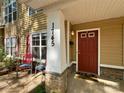 Inviting front porch with stone accents and a stylish red front door at 1745 Matheson Ave, Charlotte, NC 28205
