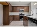 Modern kitchen with stainless steel appliances, wooden cabinets, and light countertops at 2231 Catawba Trace Dr, Catawba, NC 28609