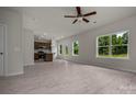 Open-concept living room and kitchen area with hardwood floors and ample natural light at 2231 Catawba Trace Dr, Catawba, NC 28609