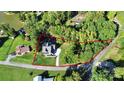 An aerial view showcasing property lines, surrounding greenery, and a well-maintained driveway at 3915 Chevlot Hills Rd, Sherrills Ford, NC 28673