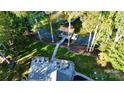 Aerial shot of a backyard boasting a waterfront firepit, dock, and seating area; an entertainer's dream at 3915 Chevlot Hills Rd, Sherrills Ford, NC 28673