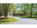 Charming brick home with a welcoming front porch and attached two-car garage at 4067 Old Buff Rd, Hickory, NC 28602