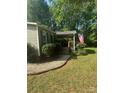 Charming single-story home with a covered front porch and an American flag in a lush, green yard at 5029 E Nc 10 Hwy Rd # 6, Catawba, NC 28609