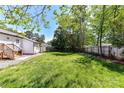 Expansive backyard featuring a well-maintained lawn and privacy fence at 8210 Lantana Dr, Denver, NC 28037