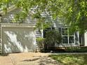 Charming single-Gathering home with a well-manicured lawn, a one-car garage, and traditional siding at 8608 Warwick Crest Ln, Charlotte, NC 28215