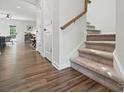 Staircase with wood floors and carpeted steps, connecting the living spaces to the upper level at 9424 Avery Lilac Ln # 83, Fort Mill, SC 29707