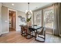 Sophisticated dining room with large windows, modern light fixture, and comfortable seating for six at Tbd Boomer Ct # 7, Statesville, NC 28677