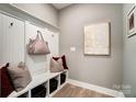 Charming mudroom featuring built-in bench, storage cubbies, coat hooks, and a neutral color palette at Tbd Boomer Ct # 7, Statesville, NC 28677