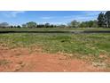 Picture of land for sale with lush grass and trees in the background at 1030 Gardenia Dr # 2, Mt Ulla, NC 28125