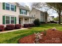 Residential street showcasing house with a manicured lawn and welcoming front porch at 1540 Coatsworth Ln, Rock Hill, SC 29732