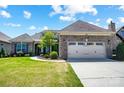 Stunning brick home with manicured lawn, two-car garage, and elegant entrance at 17315 Langston Dr, Charlotte, NC 28278