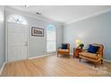 Bright living room featuring hardwood floors, a decorative window, and comfortable seating at 212 Kilborne Rd, Mooresville, NC 28117